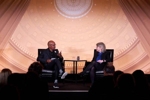 President Kornbluth (left) sits with Robert Wickham (right) on stage and discusses the Climate Project at MIT.