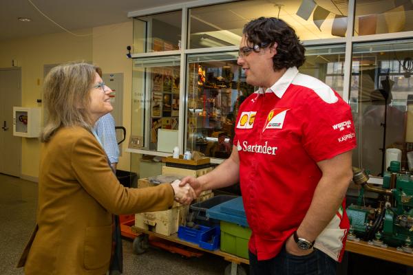 President Kornbluth (left) smiles and shakes hands with Amos Winter (right), associate professor of mechanical engineering in Pappalardo Lab.