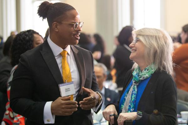 President Kornbluth and Steve Branch chat at the MLK Celebration Luncheon