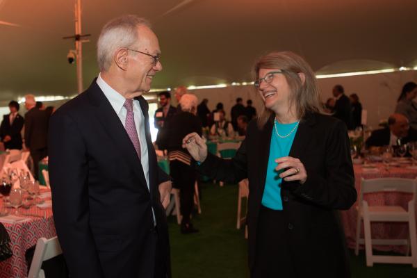 President Emeritus Reif stands on the left of President Kornbluth (right) as they share a laugh together during the Inaugural Luncheon.