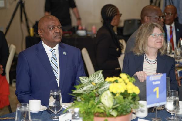 President Mokgweetsi Masisi of Botswana (left) and President Kornbluth (right) sit side by side at a table at the Legatum Center at MIT.