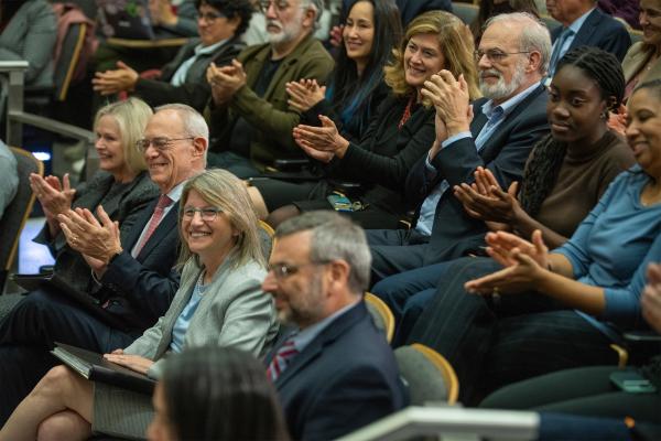 Audience members applauded during at an event welcoming Kornbluth to the MIT community