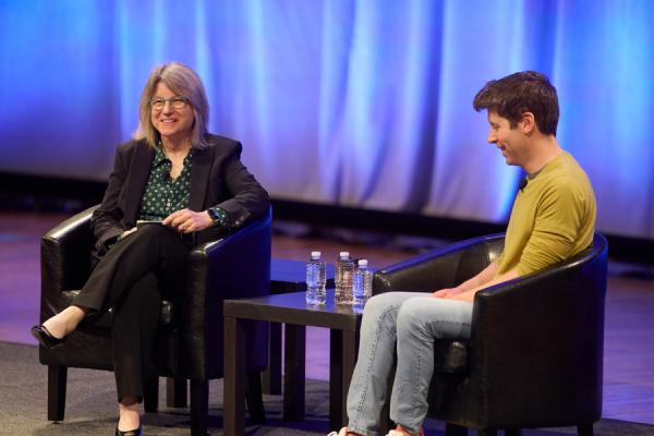 President Kornbluth (left) sits on stage in conversation with OpenAI CEO Sam Altman (right).
